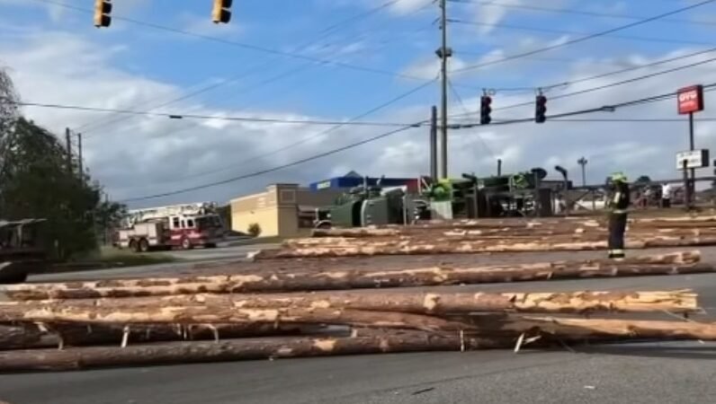 Log Truck Overturns in East Macon Crash, Scattered Logs Block Intersection